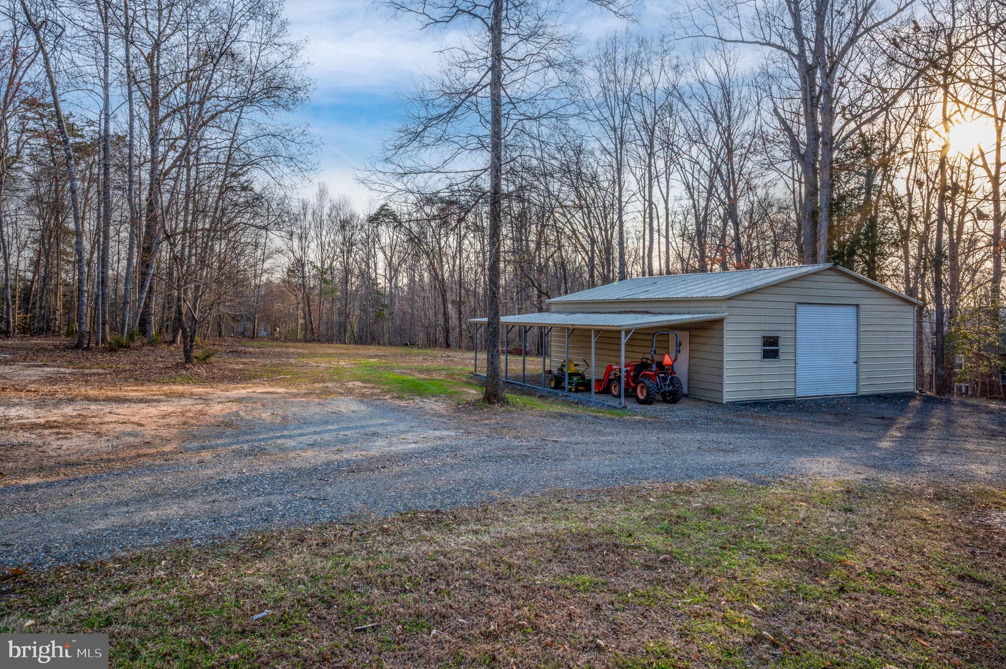 31 River Ridge Lane Fredericksburg, VA 22406 - Photo 66 of 70 a front view of a house with a yard and garage