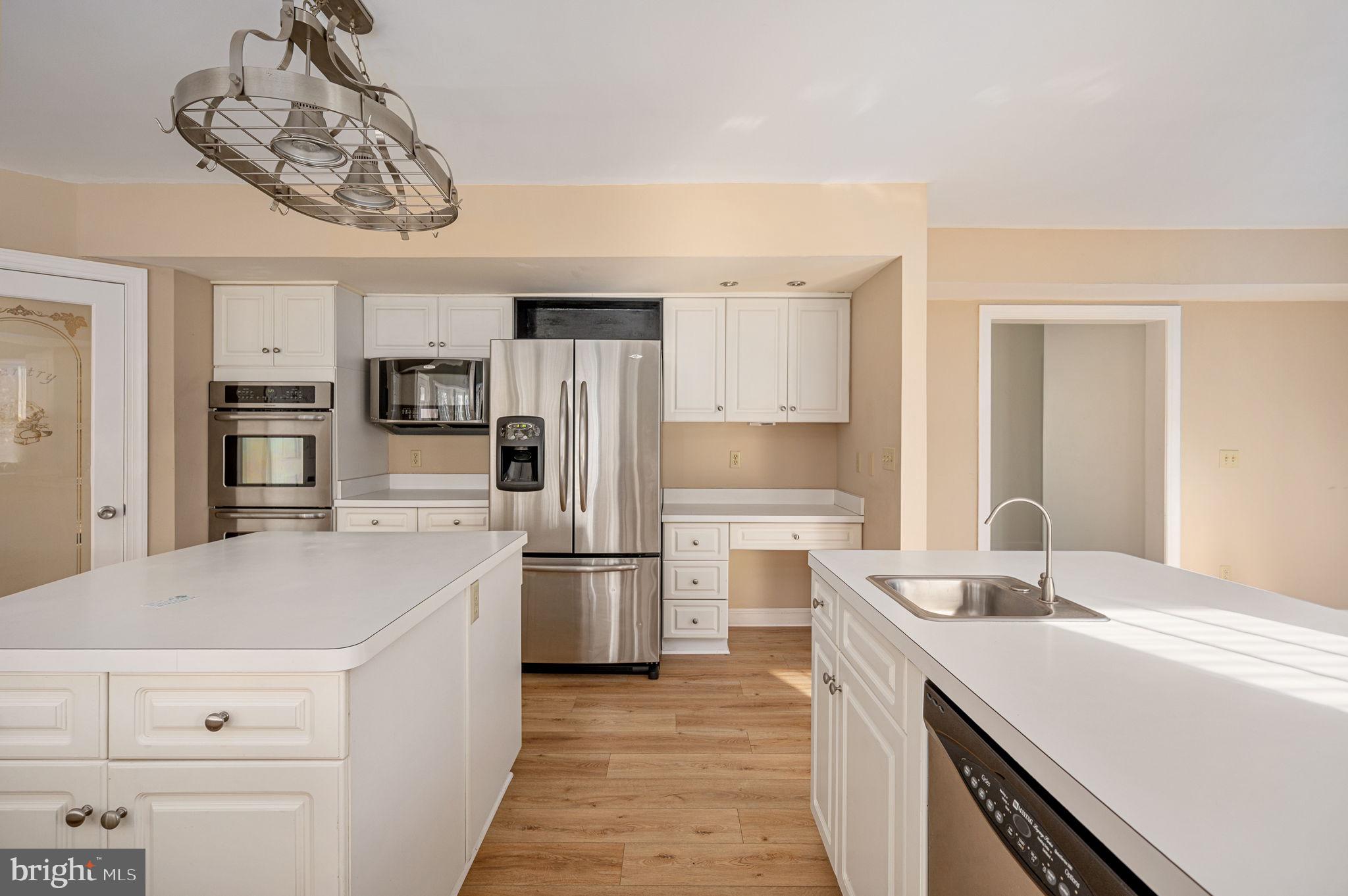 31 River Ridge Lane Fredericksburg, VA 22406 - Photo 10 of 70 a kitchen with white cabinets and stainless steel appliances
