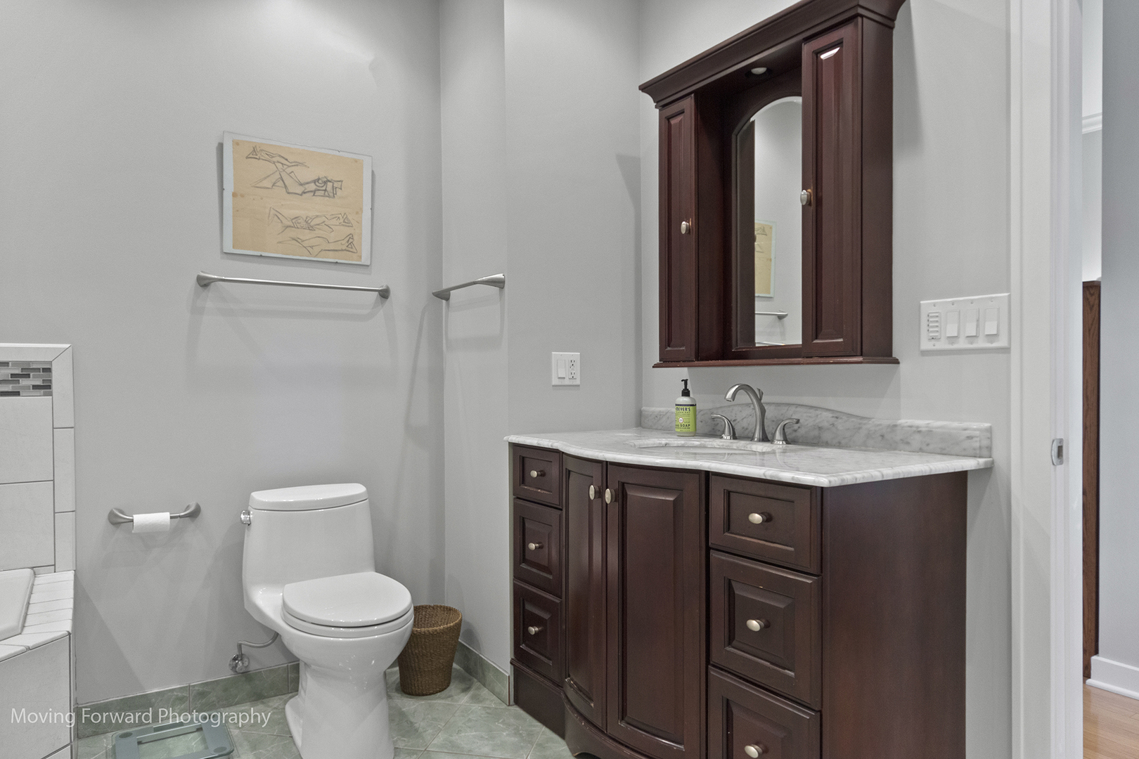 2518 Ridgeway Avenue Evanston, IL 60201 - Photo 13 of 21 a bathroom with a toilet a sink and mirror