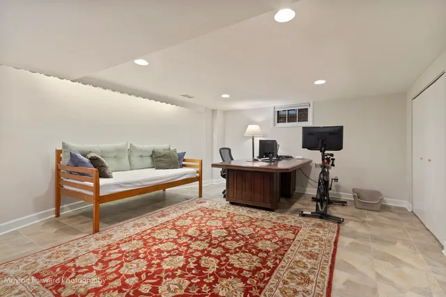 a living room with furniture a rug and a fireplace