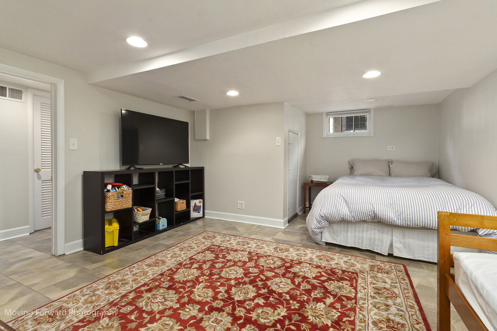 2518 Ridgeway Avenue Evanston, IL 60201 - Photo 15 of 21 a bedroom with a bed and a flat screen tv
