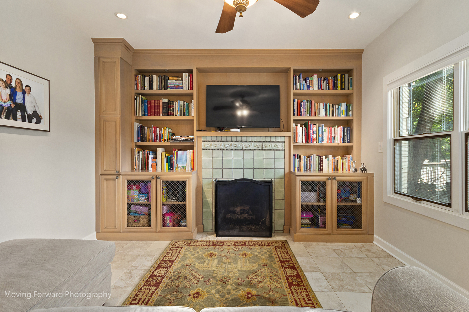 2518 Ridgeway Avenue Evanston, IL 60201 - Photo 7 of 21 a living room with bookshelf and a fireplace
