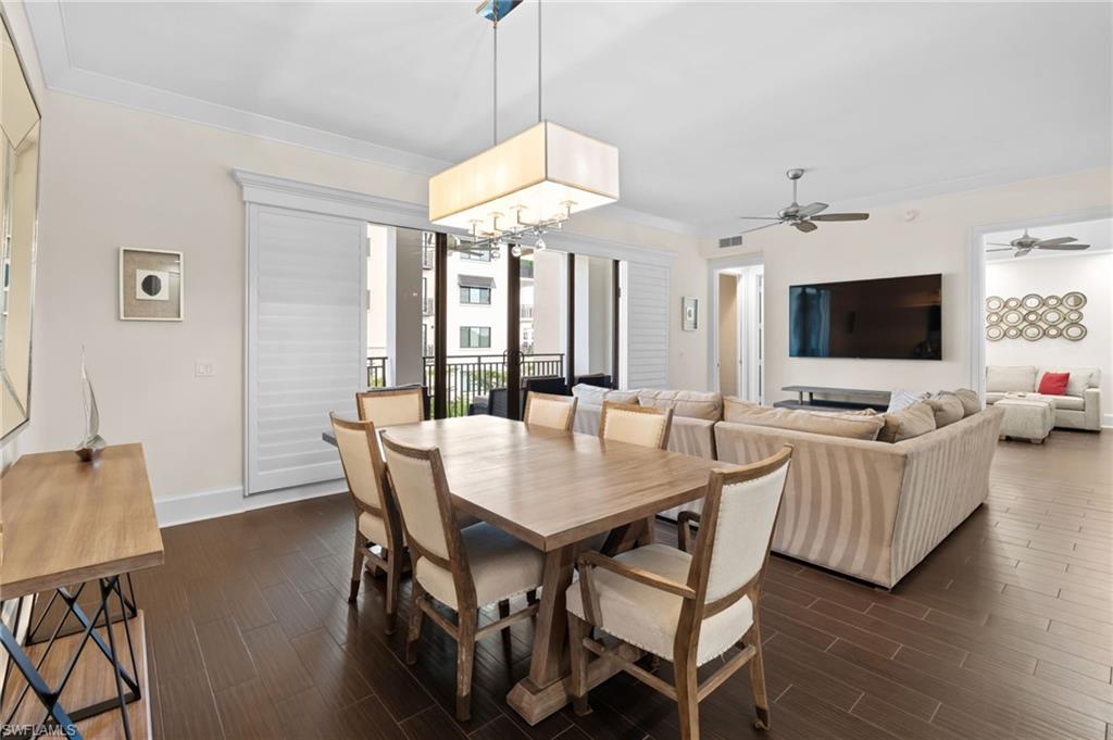1030 3rd Avenue South, Unit 319 Naples, FL 34102 - Photo 11 of 42 a view of a dining room with furniture window and wooden floor