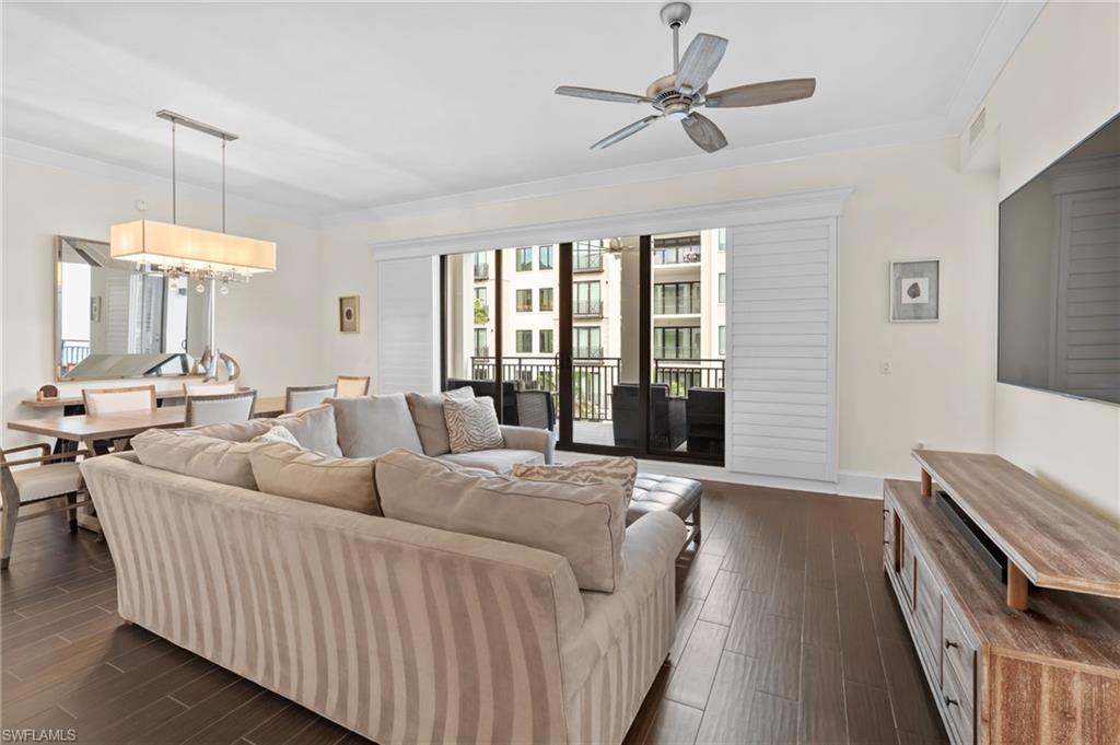 1030 3rd Avenue South, Unit 319 Naples, FL 34102 - Photo 3 of 42 a living room with furniture and a chandelier