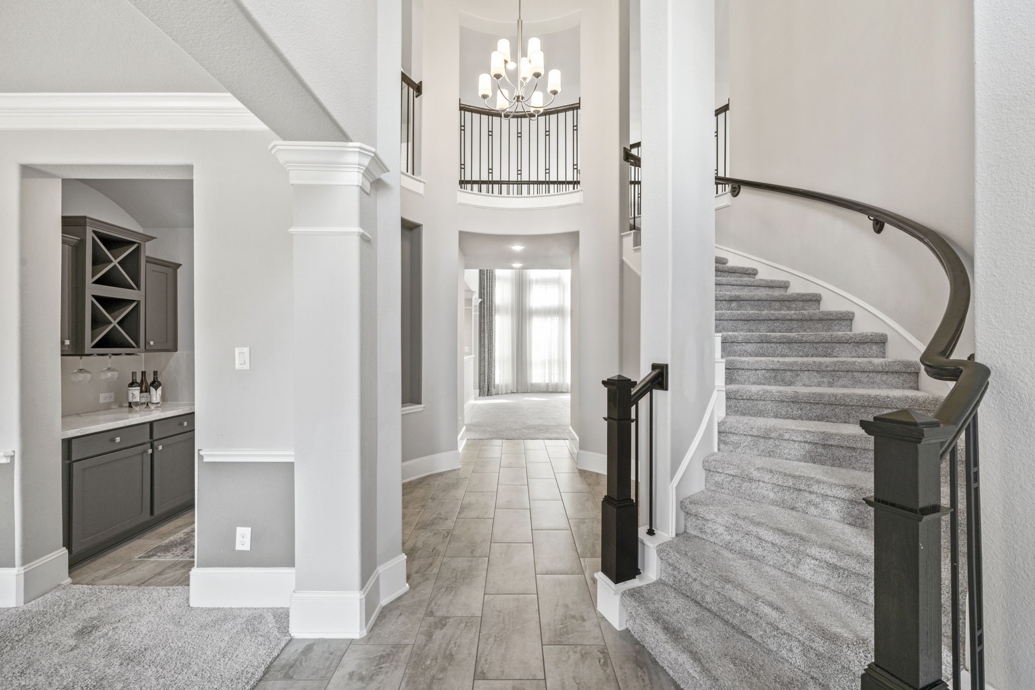 3938 Avalon Ridge Drive Spring, TX 77386 - Photo 4 of 49 Welcome in to this pretty foyer with high ceilings and tile flooring. The curved staircase is dramatic and inviting
