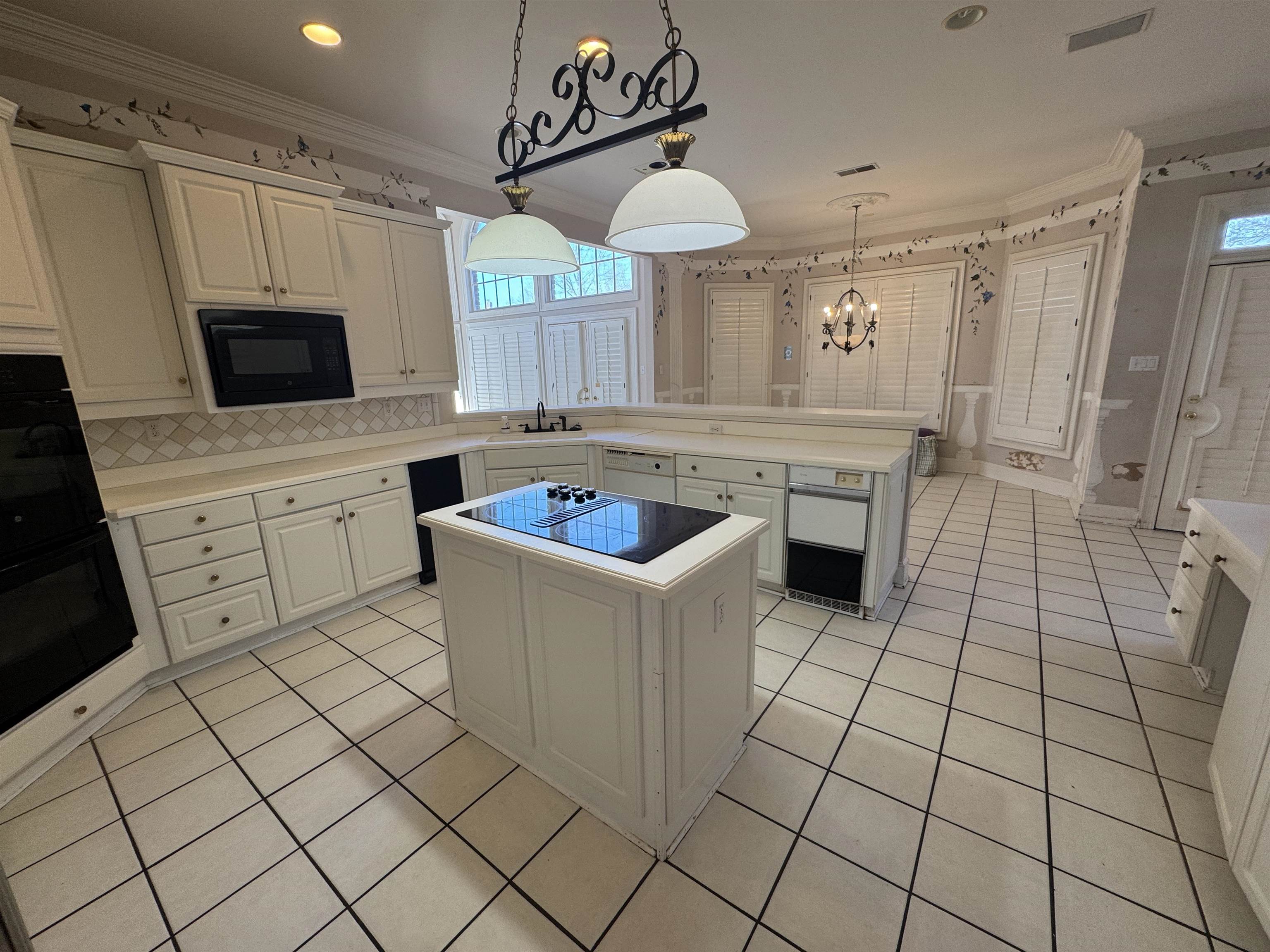 9500 Plantation Lake Road Collierville, TN 38017 - Photo 12 of 40 a kitchen with stainless steel appliances a stove a sink and a refrigerator