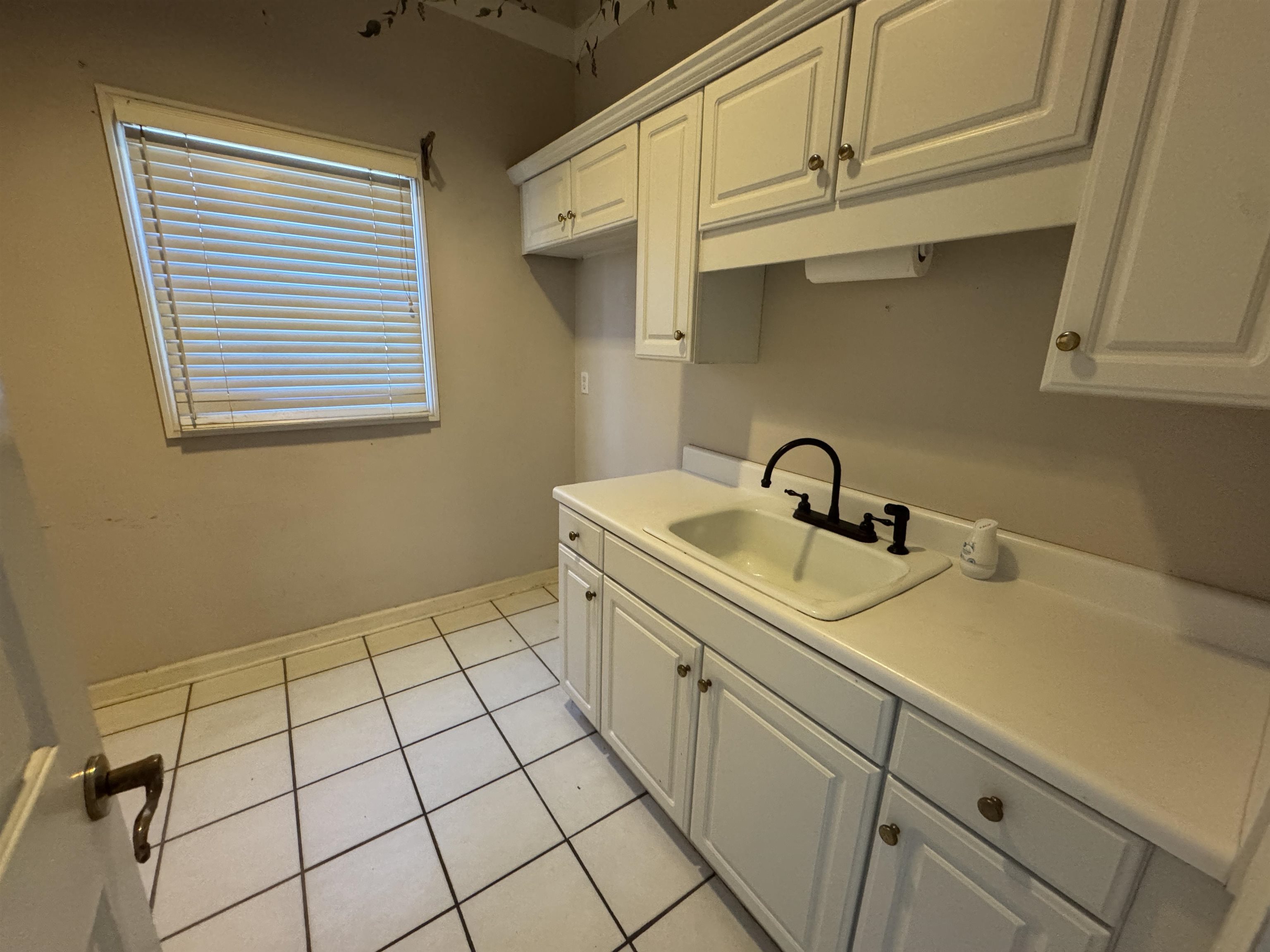 9500 Plantation Lake Road Collierville, TN 38017 - Photo 19 of 40 a view of a kitchen that has a sink and cabinets