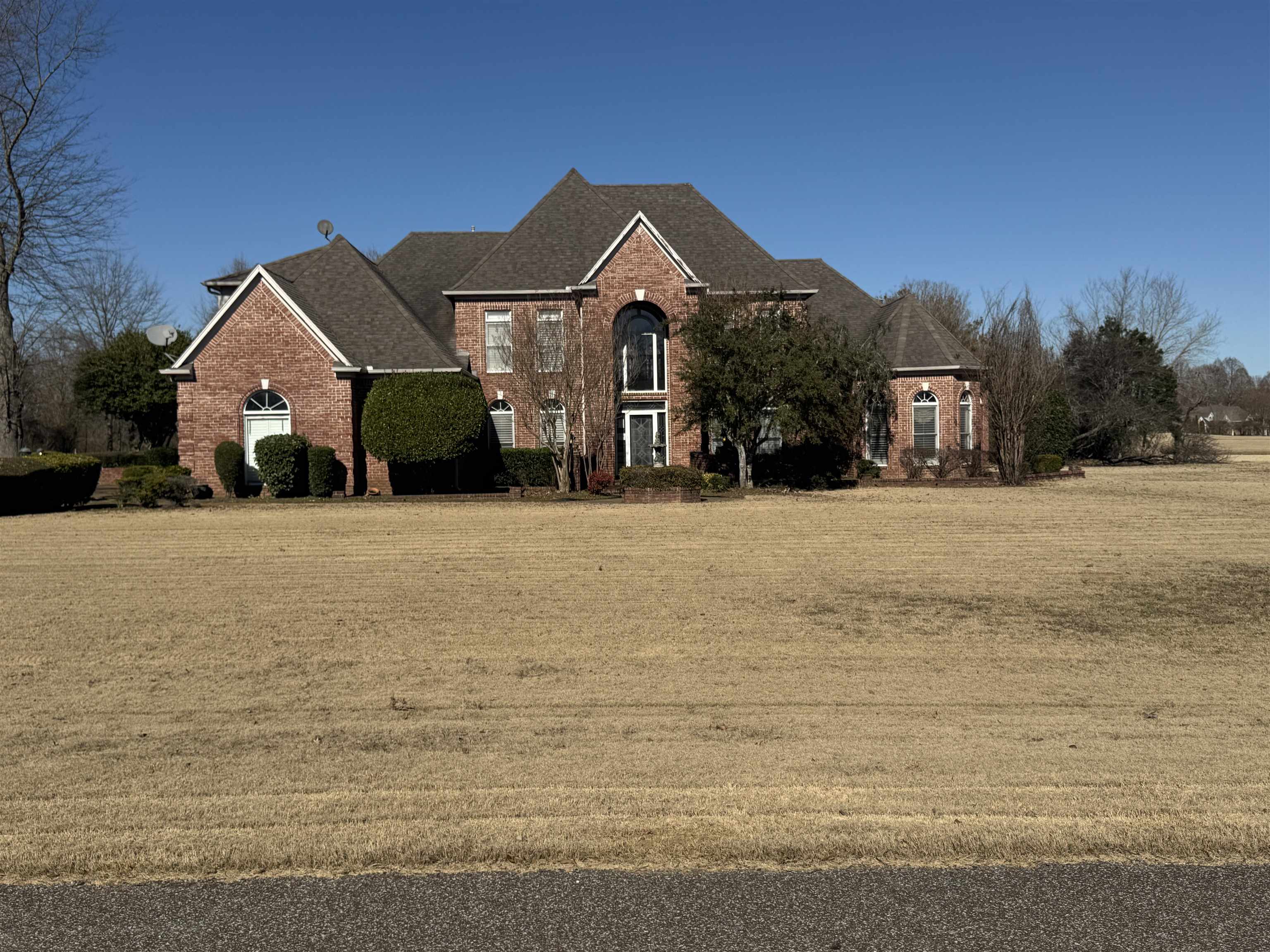 9500 Plantation Lake Road Collierville, TN 38017 - Photo 20 of 40 View of front of house with a front yard and brick siding