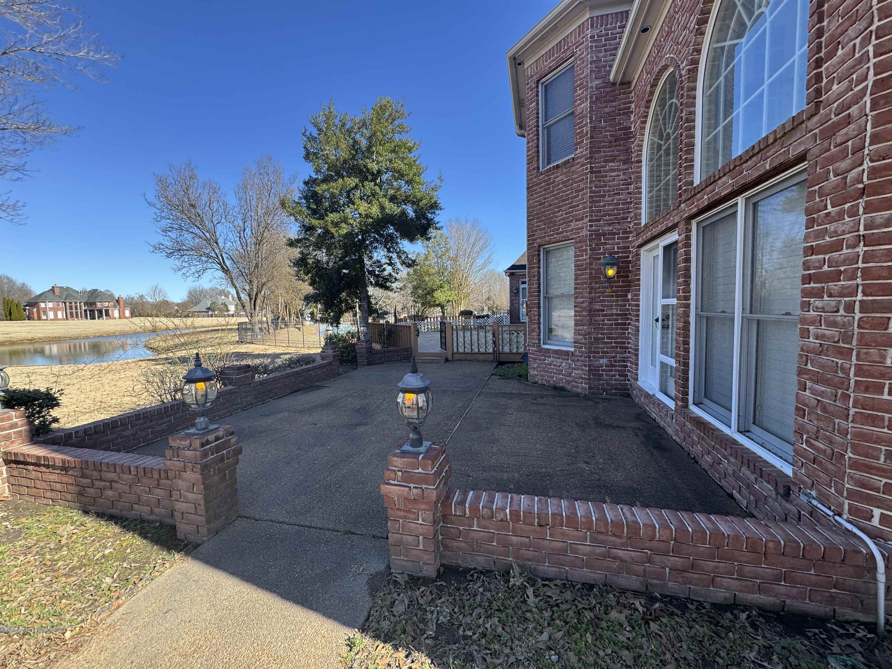 9500 Plantation Lake Road Collierville, TN 38017 - Photo 2 of 40 a view of a street with houses on both side of the road