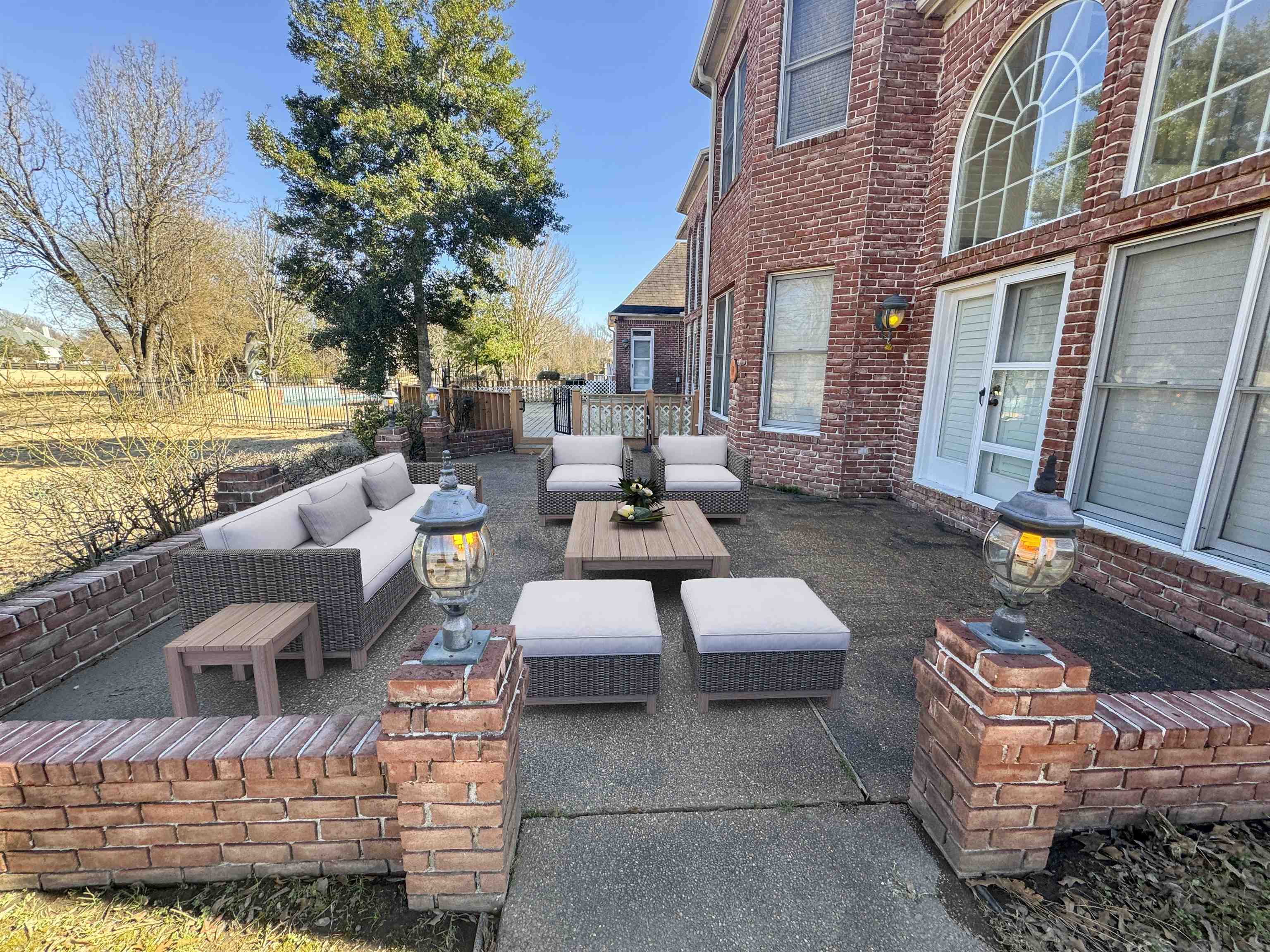 9500 Plantation Lake Road Collierville, TN 38017 - Photo 3 of 40 a view of a patio with couches table and chairs and potted plants