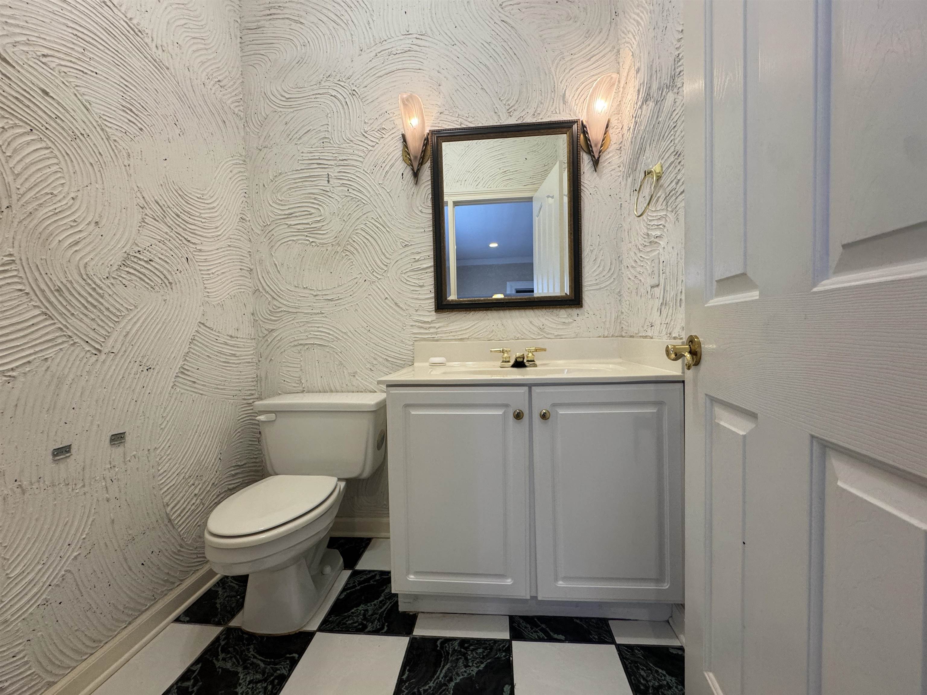 9500 Plantation Lake Road Collierville, TN 38017 - Photo 3 of 40 Half bathroom with vanity, marble finish floor, and toilet
