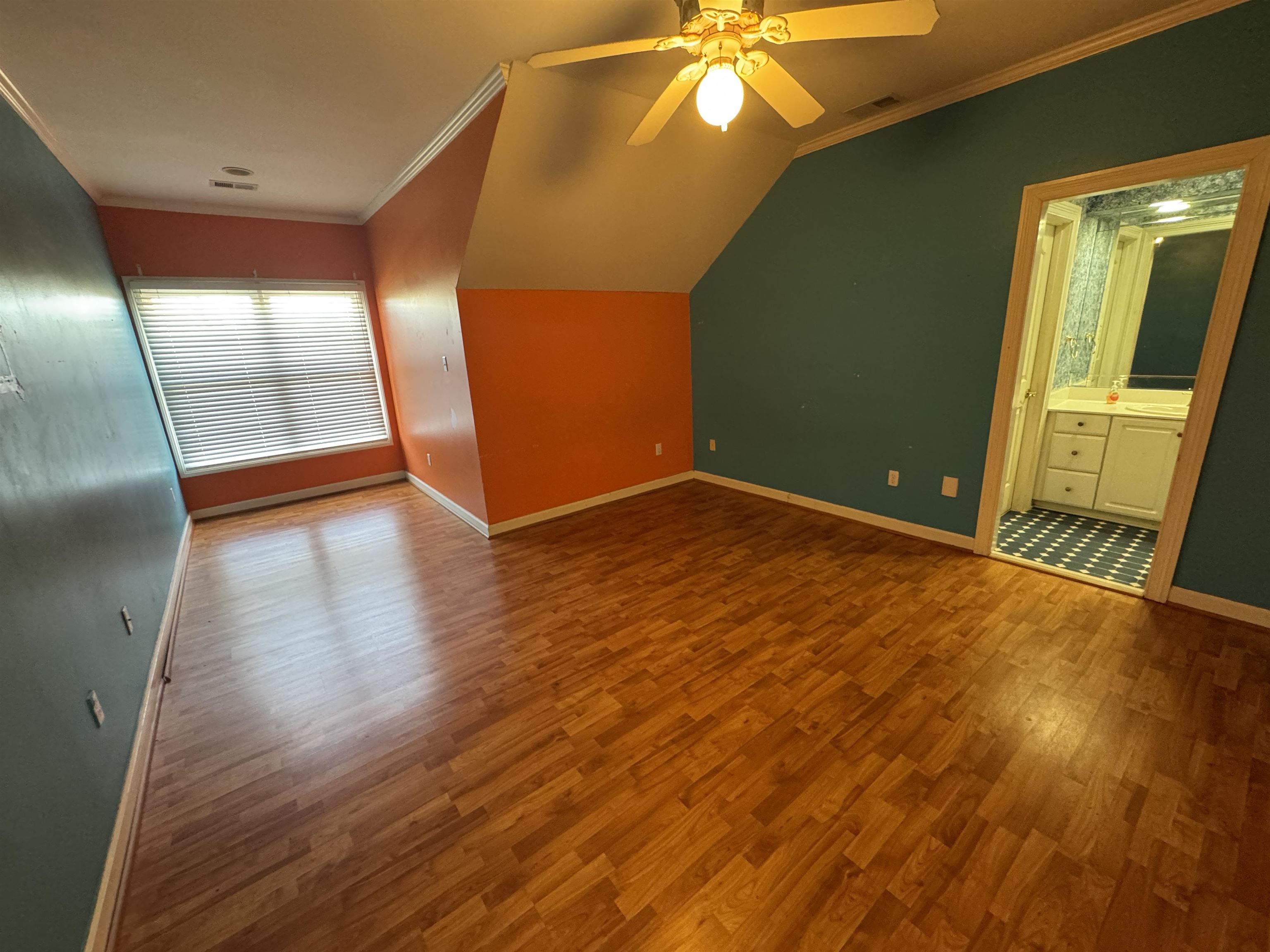 9500 Plantation Lake Road Collierville, TN 38017 - Photo 35 of 40 Bonus room with baseboards, a ceiling fan, visible vents, lofted ceiling, and wood finished floors