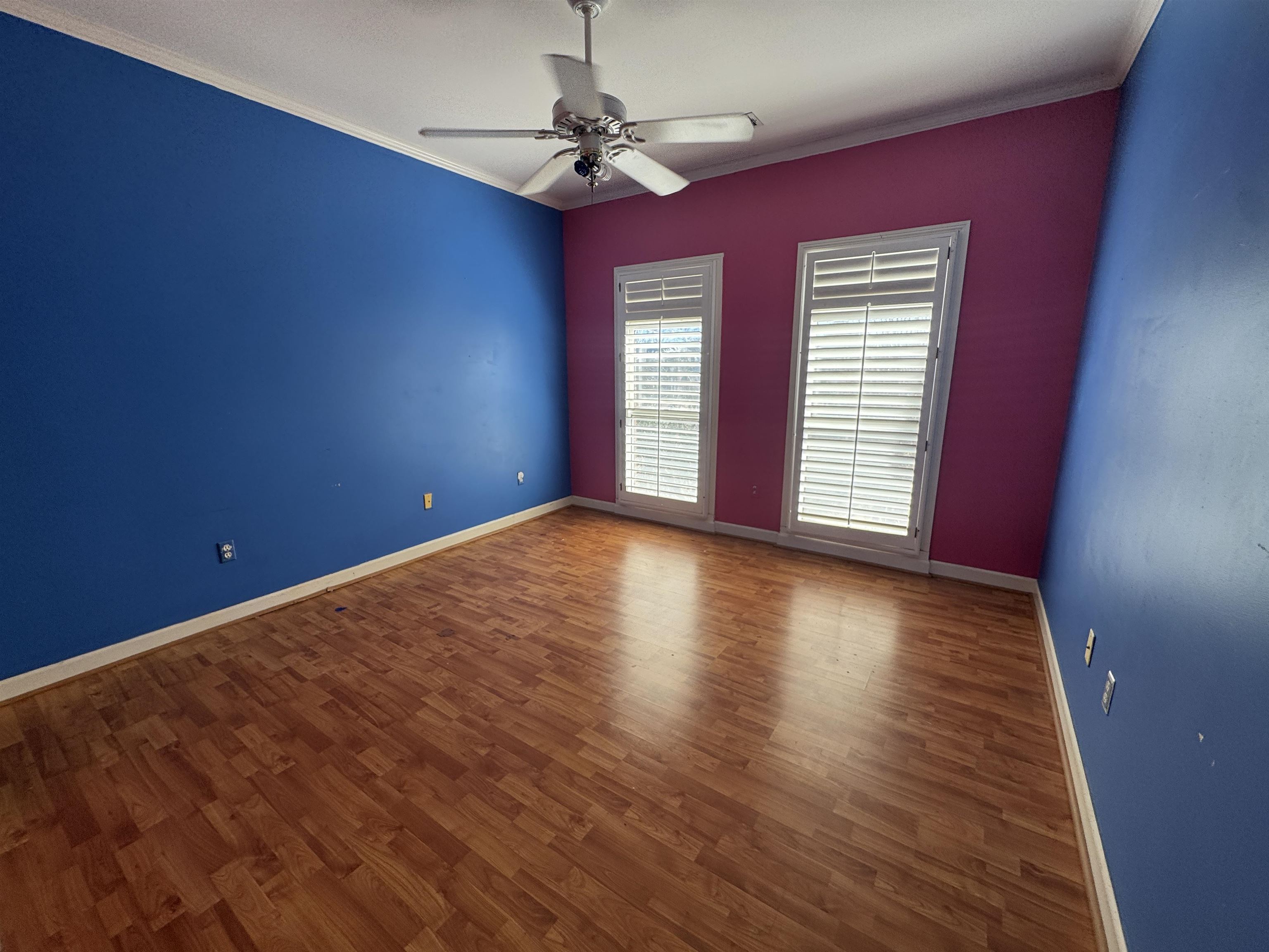 9500 Plantation Lake Road Collierville, TN 38017 - Photo 36 of 40 a view of empty room with wooden floor and fan