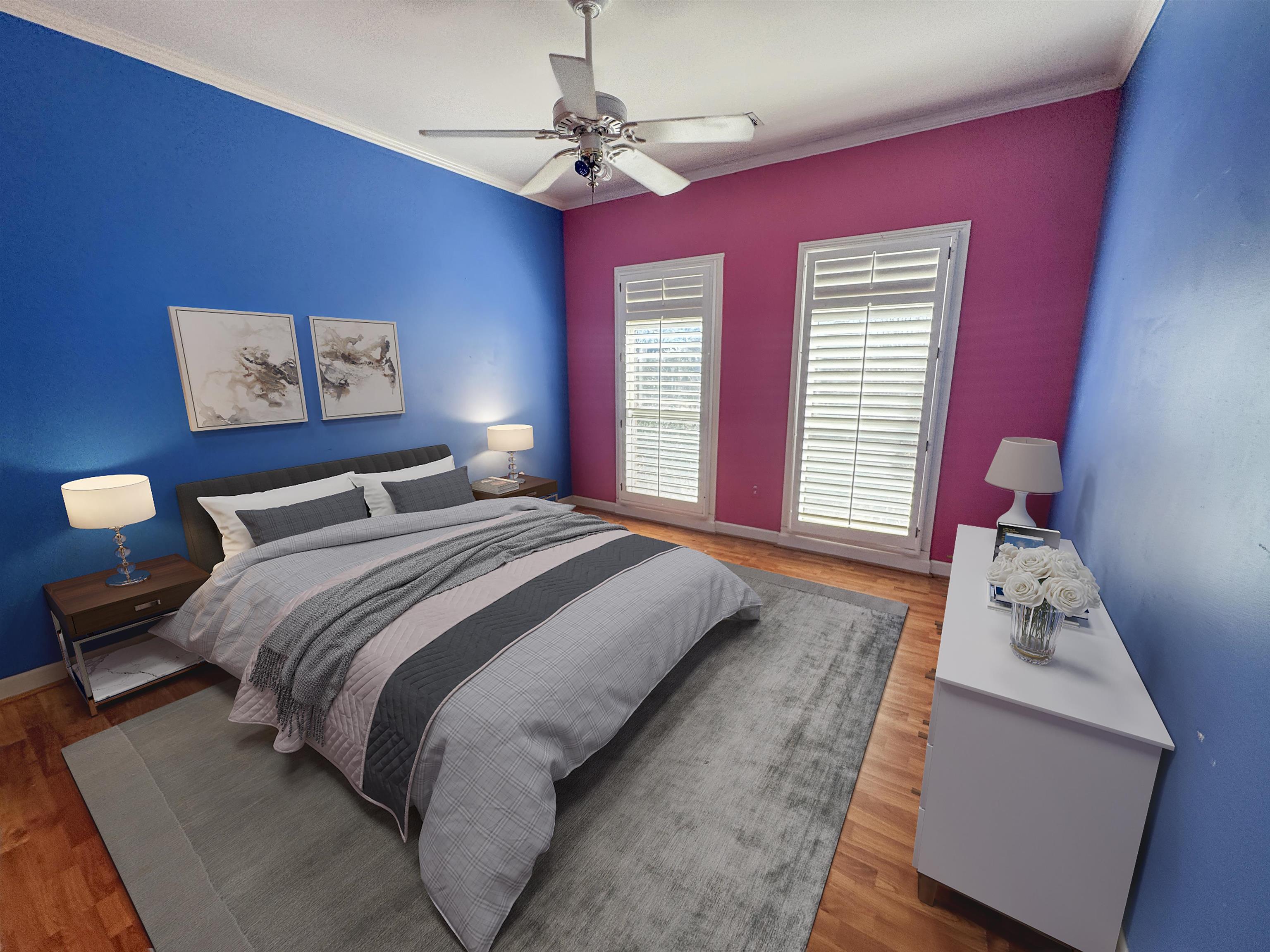 9500 Plantation Lake Road Collierville, TN 38017 - Photo 37 of 40 a bedroom with a bed and a chandelier