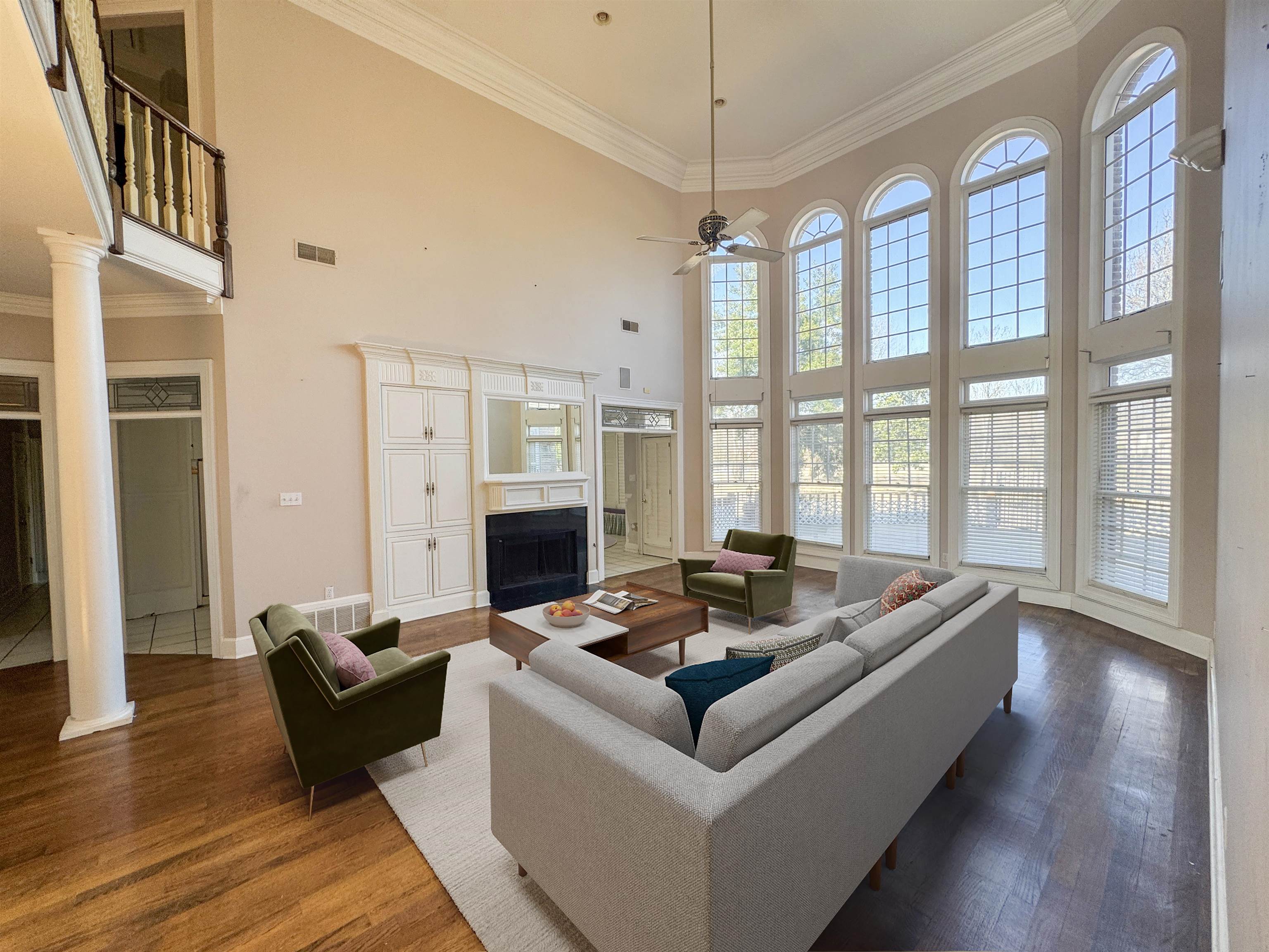 9500 Plantation Lake Road Collierville, TN 38017 - Photo 4 of 40 Living room with plenty of natural light, a towering ceiling, and a fireplace