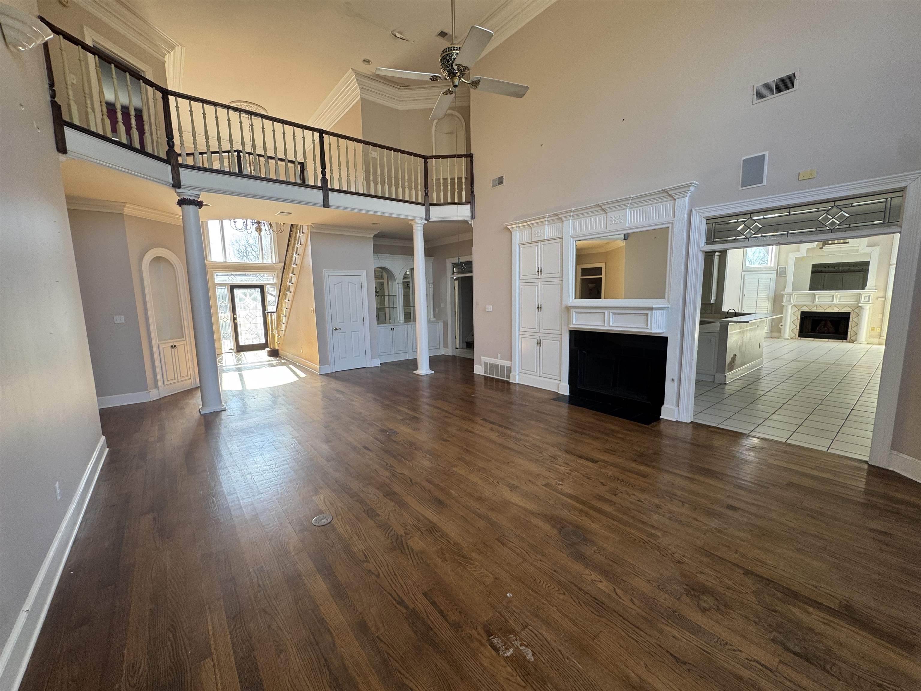 9500 Plantation Lake Road Collierville, TN 38017 - Photo 9 of 40 wooden floor in an empty room with a window