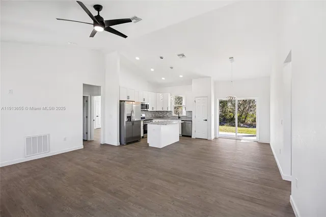 a view of a kitchen with a sink and a window