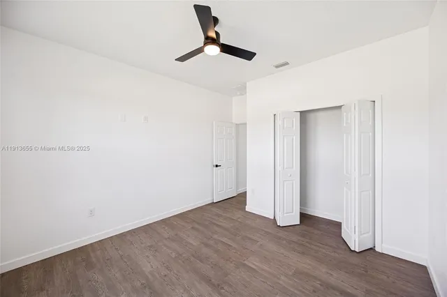 a view of room with hardwood floor