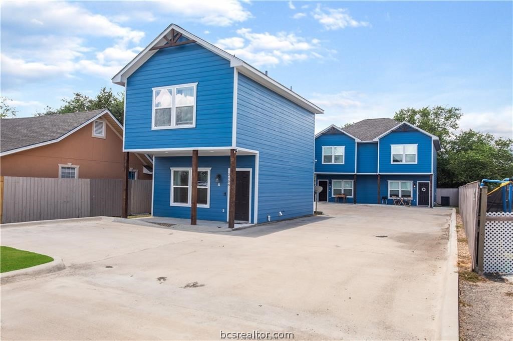 2108 Cavitt Avenue, Unit A Bryan, TX 77801 - Photo 1 of 1 a front view of a house with a yard and garage