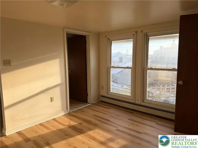 a view of an empty room and window