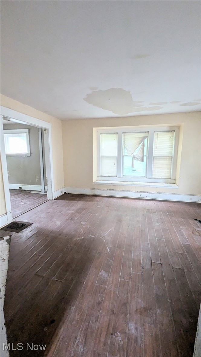 445 Cleveland Road Cleveland, OH 44108 - Photo 9 of 10 Unfurnished living room featuring hardwood / wood-style flooring and baseboards