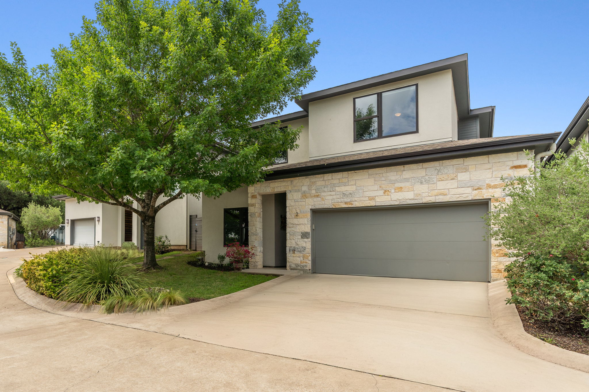 1303 Azie Morton Road, Unit 2 Austin, TX 78704 - Photo 2 of 37 An added bonus of this home is its attached two car garage and additional driveway parking.