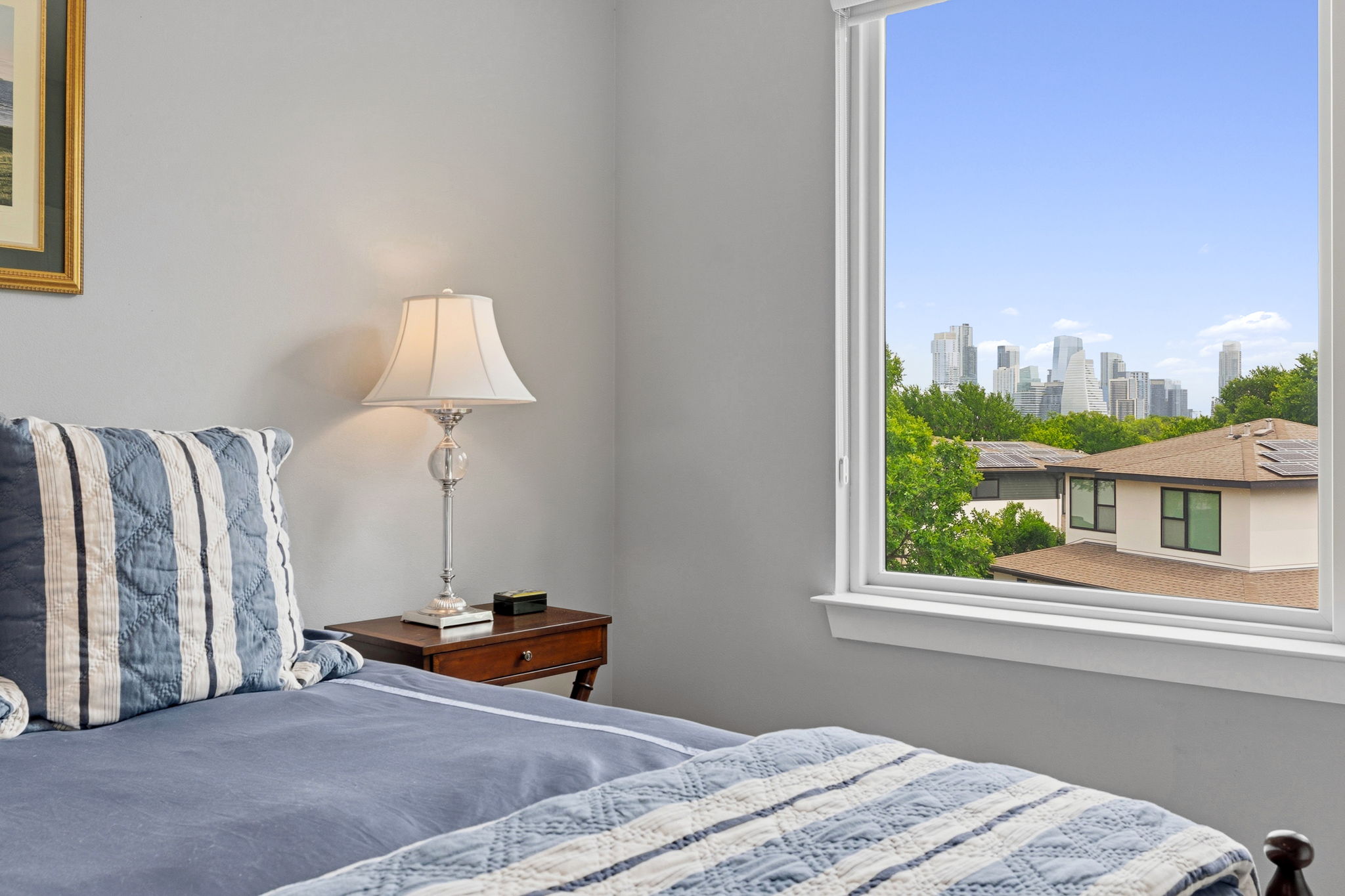 1303 Azie Morton Road, Unit 2 Austin, TX 78704 - Photo 28 of 37 Bedroom with an amazing elevated view of the Downtown skyline.