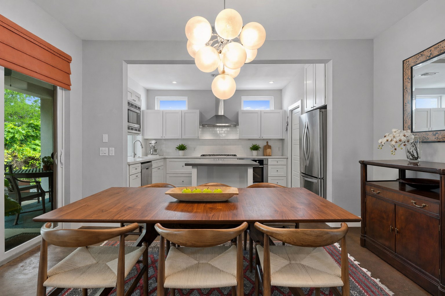 1303 Azie Morton Road, Unit 2 Austin, TX 78704 - Photo 6 of 36 a view of a dining room with furniture and chandelier