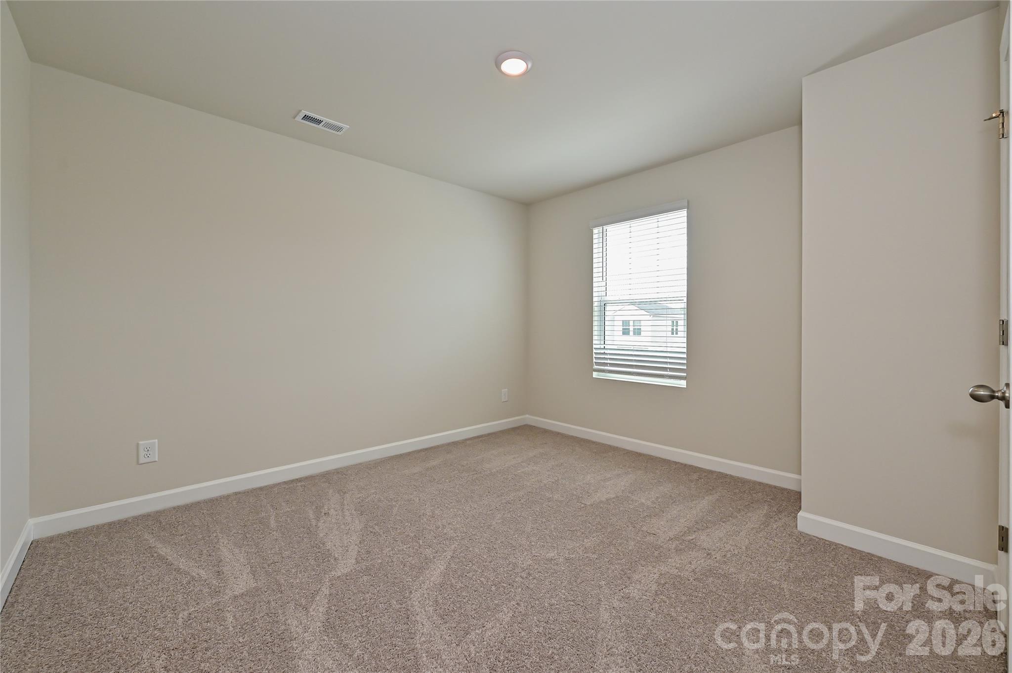 1308 30th St Lane Northeast Conover, NC 28613 - Photo 11 of 12 an empty room with windows and closet