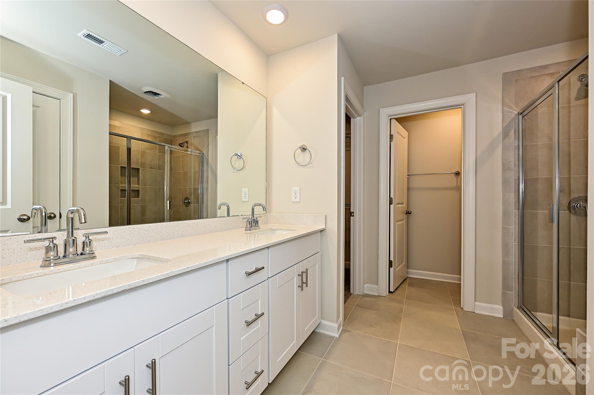 1308 30th St Lane Northeast Conover, NC 28613 - Photo 8 of 12 a spacious bathroom with a granite countertop sink mirror and shower