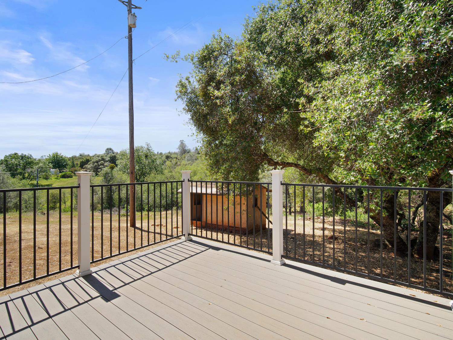 3924 Pine Cone Drive Rescue, CA 95672 - Photo 7 of 51 a view of a balcony with wooden floor next to a yard