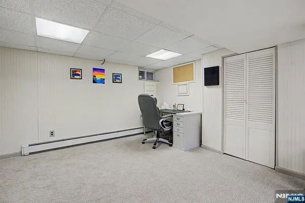 a view of house with backyard