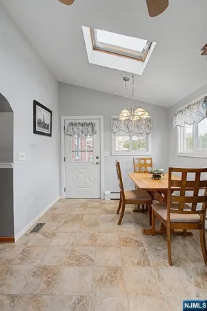 a dining room with furniture and window