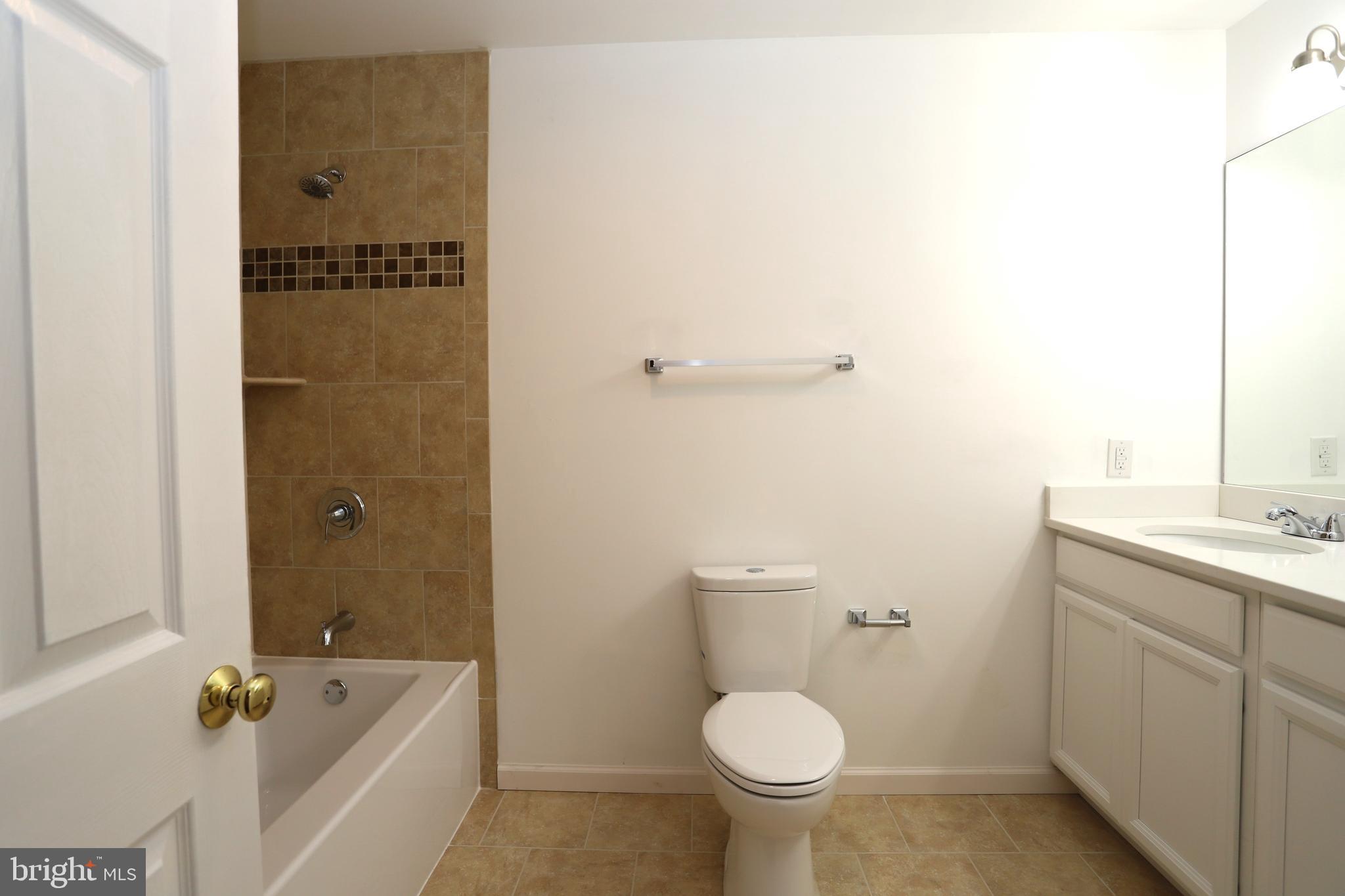 14459 Norman Road Culpeper, VA 22701 - Photo 11 of 23 a bathroom with a sink and mirror with toilet