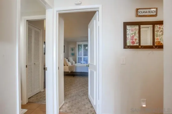 a view of a bedroom from a hallway
