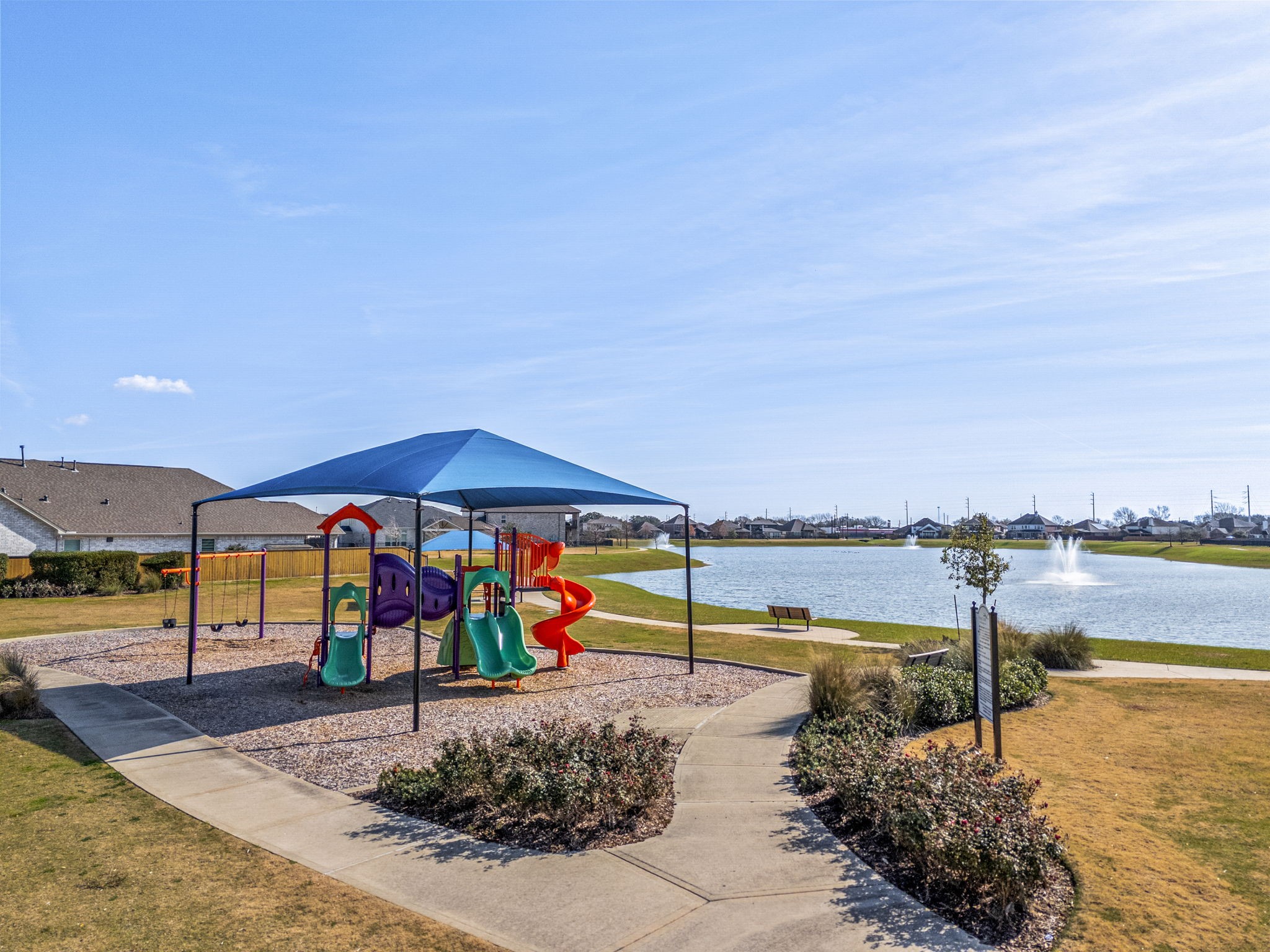 5007 Chimney Swift Lane Baytown, TX 77521 - Photo 31 of 33 Community amenities include a scenic lake with fountains . Enjoy walking trails, parks, and playgrounds within the neighborhood