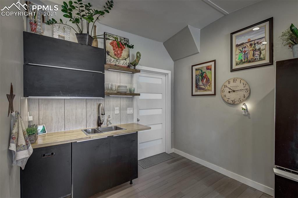 8977 Spruce Mountain Road Larkspur, CO 80118 - Photo 18 of 50 a kitchen with a sink and cabinets