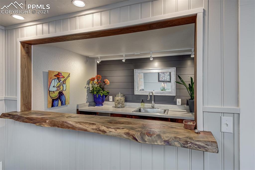 8977 Spruce Mountain Road Larkspur, CO 80118 - Photo 25 of 50 a view of a living room and hallway
