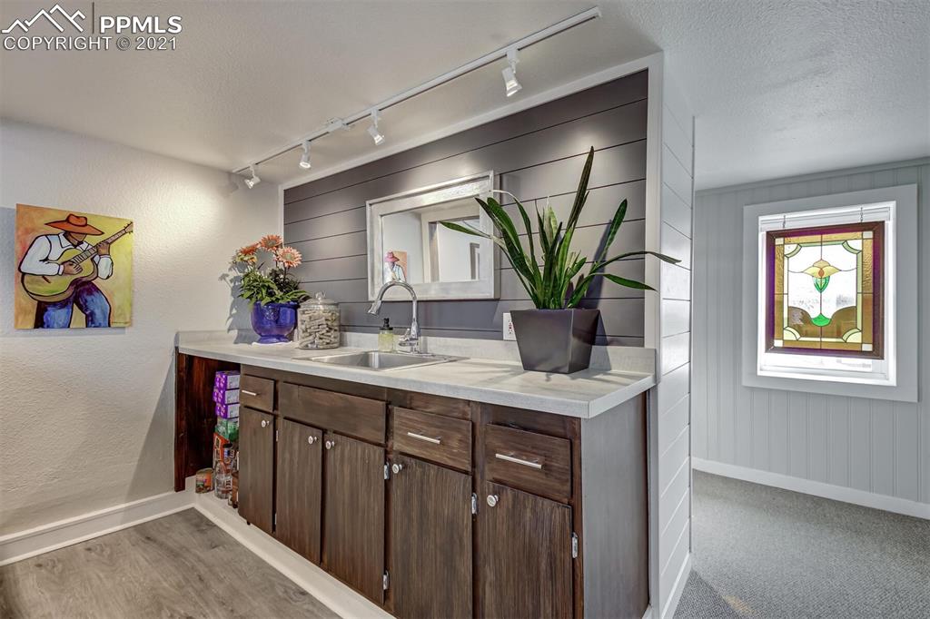 8977 Spruce Mountain Road Larkspur, CO 80118 - Photo 26 of 50 a kitchen with a sink and cabinets