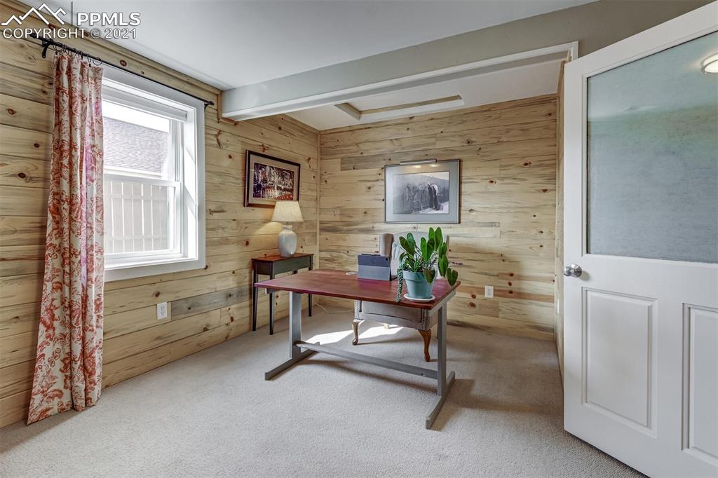 8977 Spruce Mountain Road Larkspur, CO 80118 - Photo 28 of 50 a workspace with furniture and a window