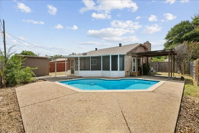 a view of pool and outdoor space