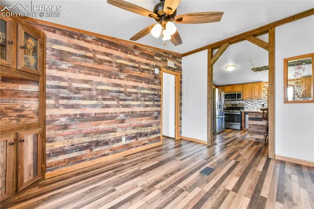 a view of a living room with a flat screen tv