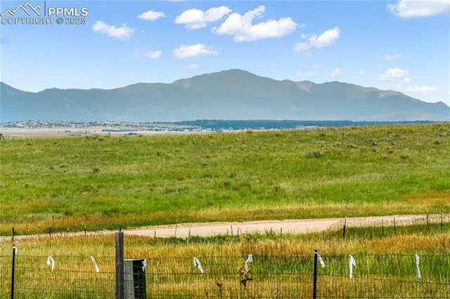 a view of an ocean and a mountain