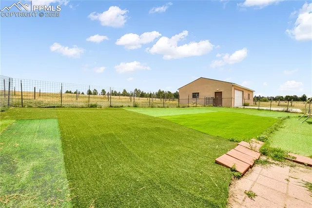 a view of a house with a big yard