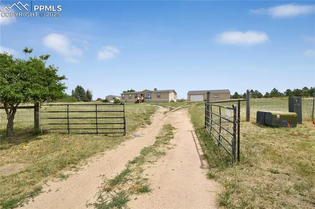 a view of ocean with a building in the background