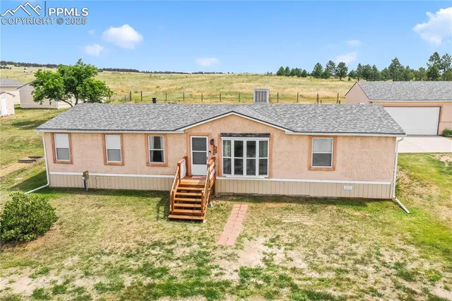 a house with swimming pool in front of it