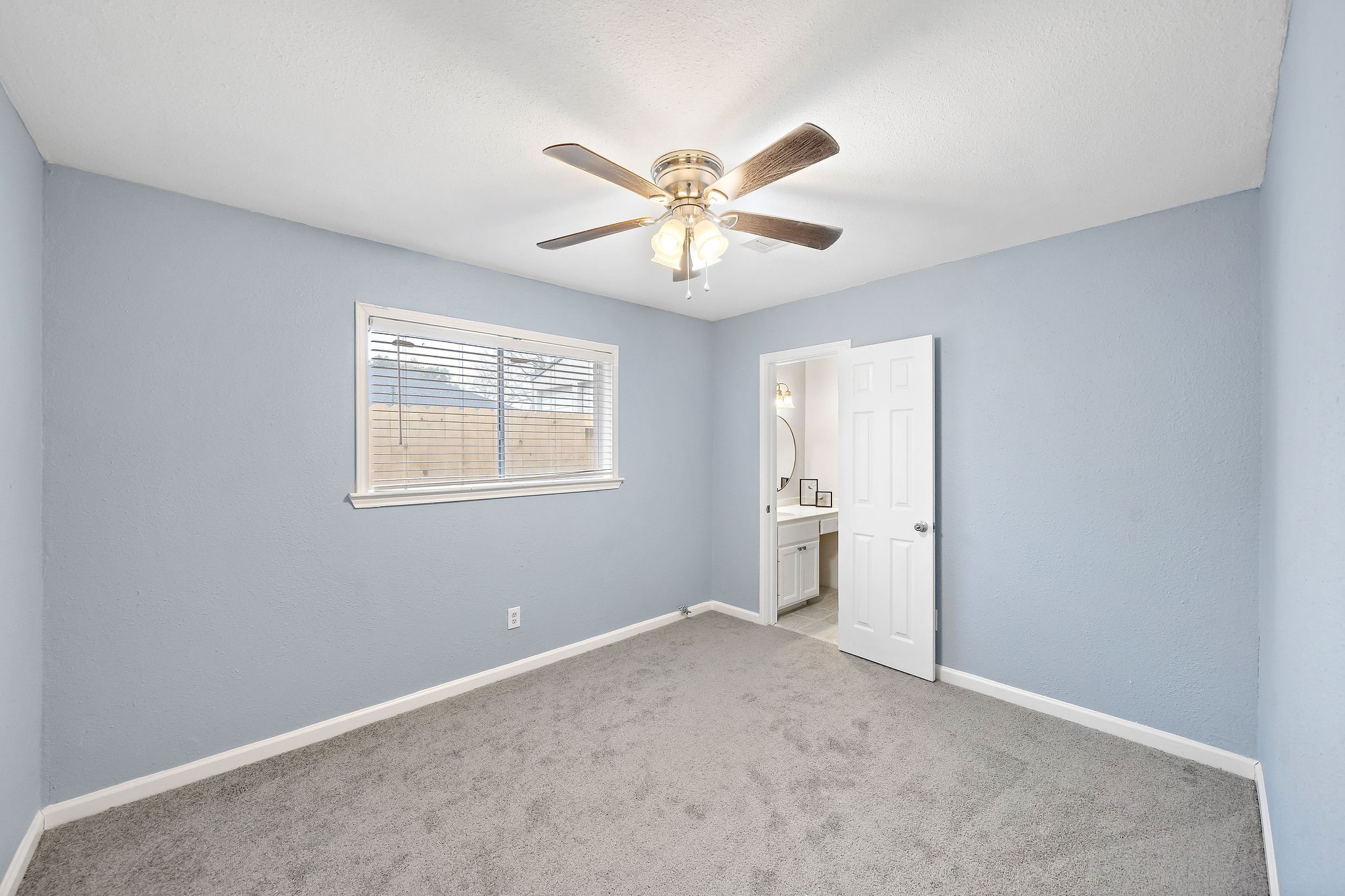 712 Damon Street Rosenberg, TX 77471 - Photo 6 of 11 a view of an empty room with a window