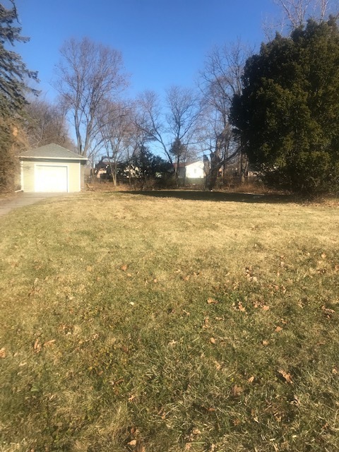 a view of yard covered with snow