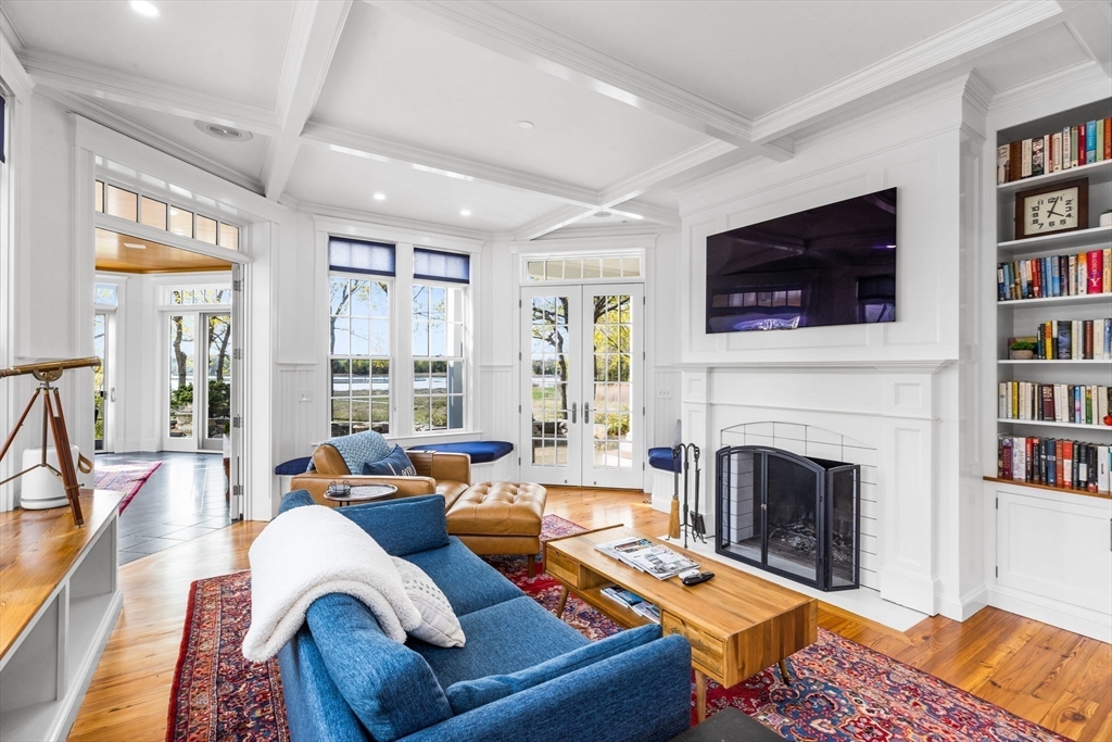 1 R Bailey's Island Road Scituate, MA 02066 - Photo 12 of 42 a living room with furniture a flat screen tv and a fireplace