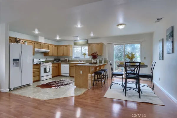 a view of a dining room with furniture and a table